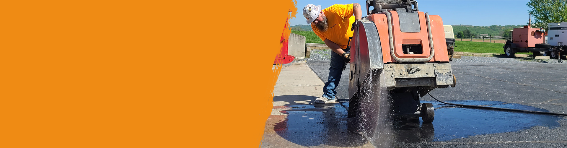 Construction worker cutting Asphalt paving for sidewalk